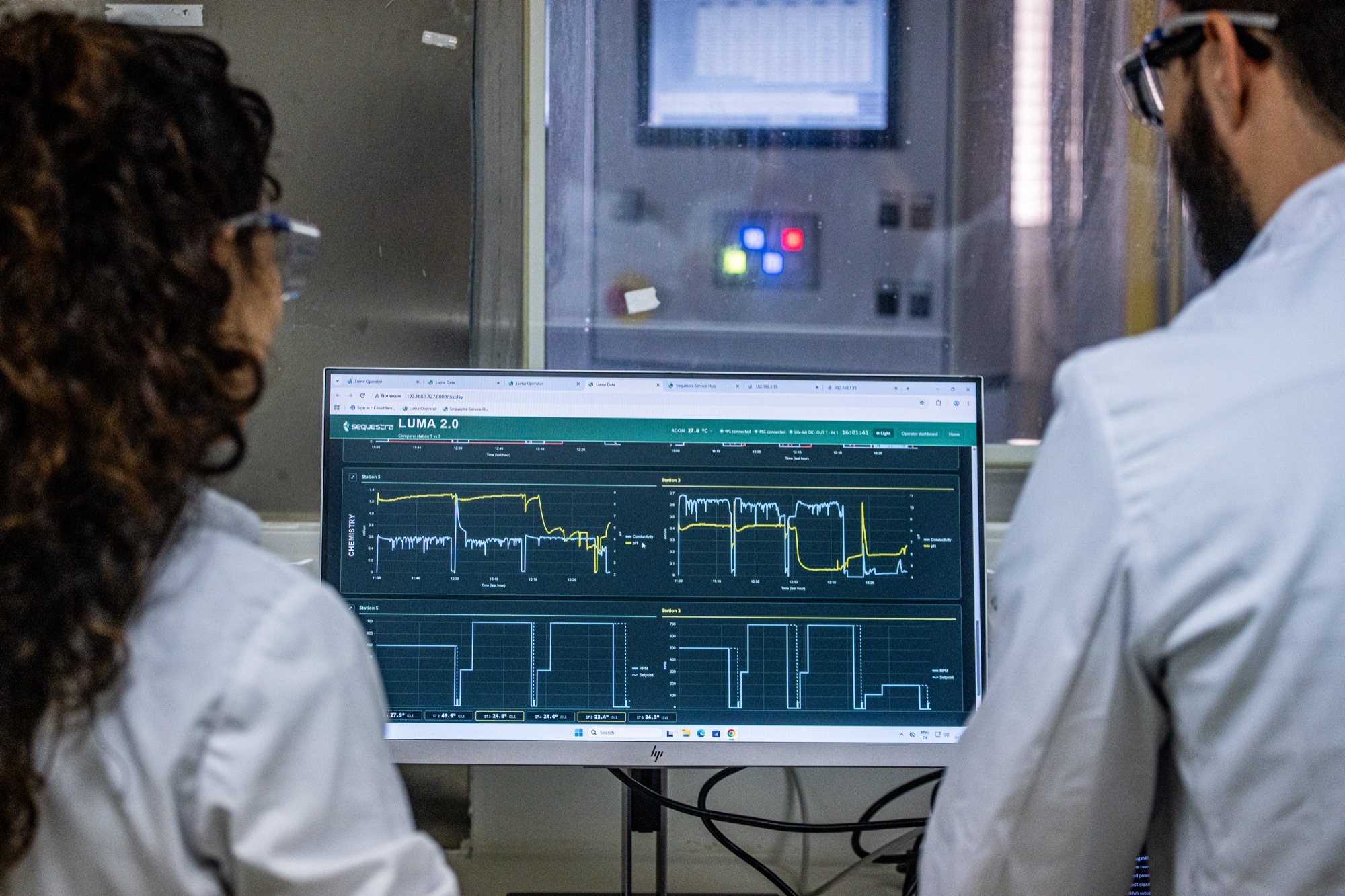 The team discussing results in the lab